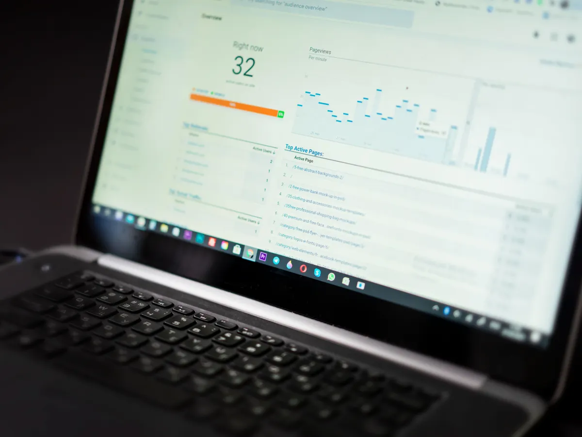 Laptop screen showing an analytics dashboard with a line chart